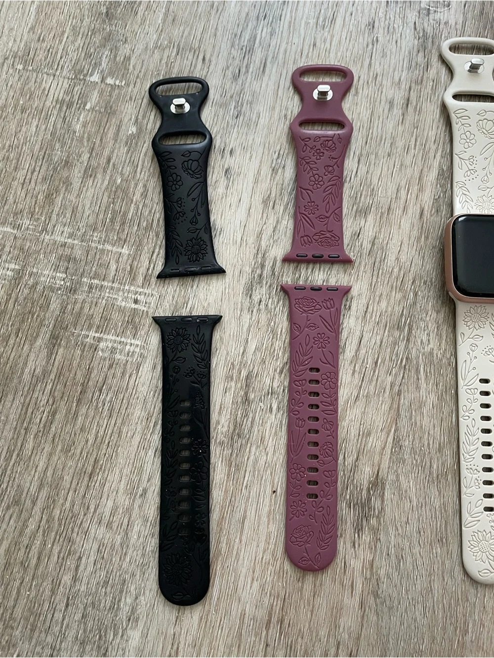 Apple Smartwatch with White, Black, and Mauve Bands